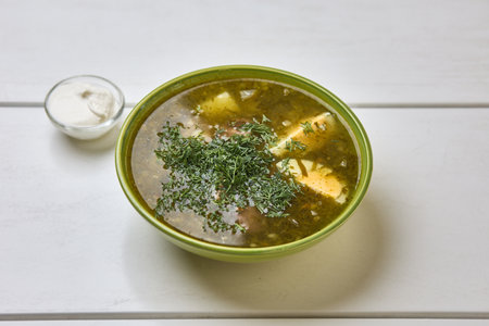 Traditional green sorrel soup with herbs and eggの写真素材