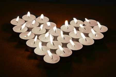 heart candle in darkの写真素材