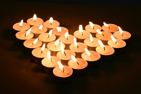 heart candle in darkの写真素材