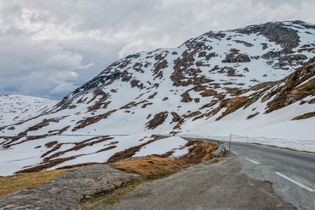 Road #63 with snowy mountain to Geiranger fjord, Norway.の写真素材