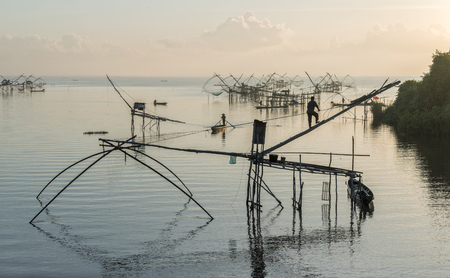 Morning scene and square dip net fishing gear at Pakpra village, Phatthalung, Thailand.の写真素材