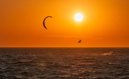Kite surf and sunset at Mykonos island, Greece.の写真素材