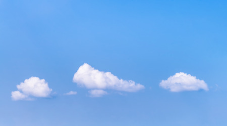 Blue sky with small white clouds.の写真素材