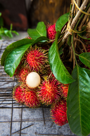 Rambutan on woodの写真素材