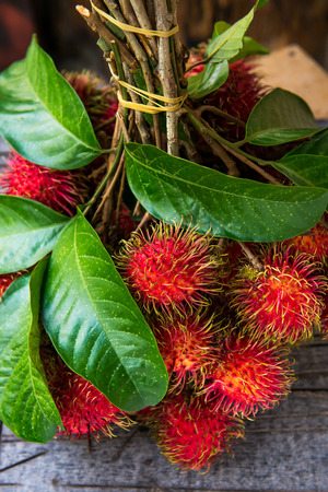 Rambutan on woodの写真素材