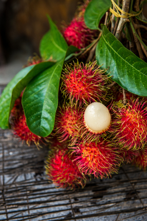 Rambutan on woodの写真素材