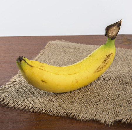 Fresh bananas on wooden backgroundの写真素材