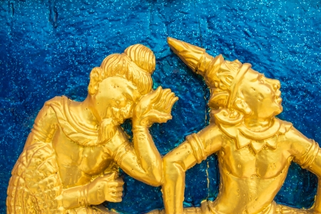 Traditional Thai art on a temple wall of Thailandの写真素材