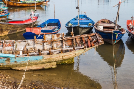 Old boats at fisherman village in Thailandの写真素材