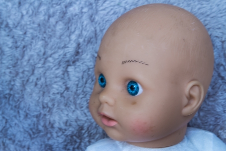 Close up of doll face on carpet backgroundの写真素材