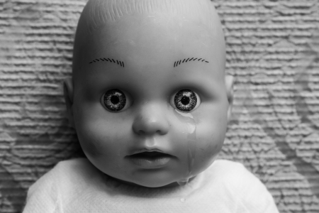 Close up of doll face with tearの写真素材