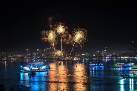 Cityscape of night skyline Pattaya City and Colorful fireworks. Celebration and anniversary concept....