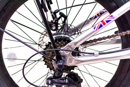 Close up wheel and chain of mountain biking. Landscape view of disc break system and front...