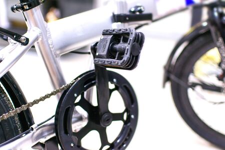 Close up wheel and chain of mountain biking. Landscape view of disc break system and front...