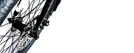 Close up wheel and chain of mountain biking. Landscape view of disc break system and front Derailleur of moutain bike. bicycle parts titanium color and frame aluminium. Shift lever and brake lever.の写真素材