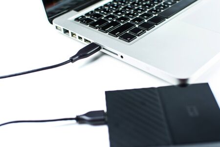 Close up of external hard disk drive for connect to laptop, transfer or backup data between computer...