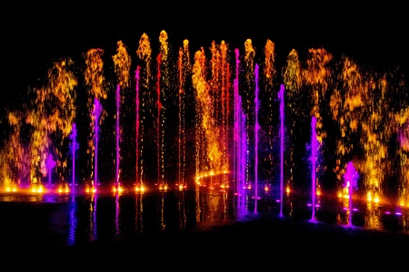 Colorful Water Fountain on Black Backgroundの素材
