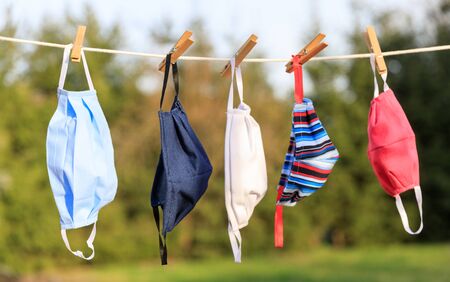 Hygienic mask hanging on the rack outdoor after being washed for cleanness and hygiene during...