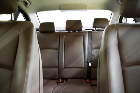 Brown leather back passenger seats in modern car, car interiorの写真素材
