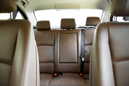 Brown leather back passenger seats in modern car, car interiorの写真素材