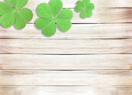 St. Patrick's Day with Green Shamrocks on Wooden Textureの写真素材