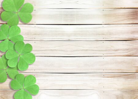 St. Patrick's Day  with Green Shamrocks on Wooden Textureの写真素材