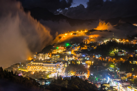 The fog moving pass Sapa village in Vietnam in evening time .の写真素材
