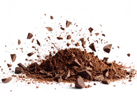A small mound of cocoa powder on a white background, with a fine and rich texture.の素材