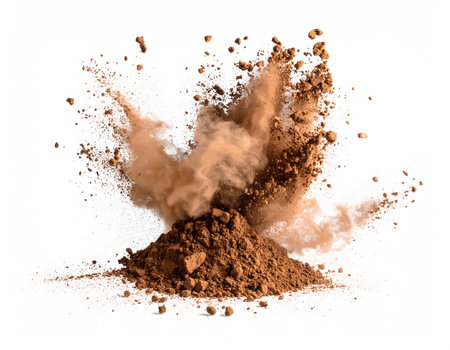 An energetic image of cocoa powder splashing up in the air, captured in a freeze-frame moment of motion and fine detail.の素材
