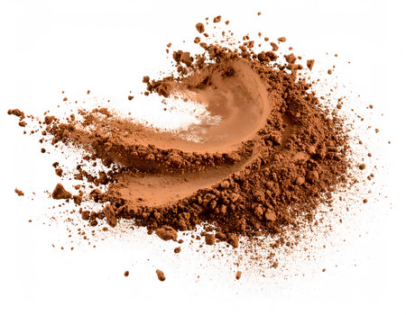 A beautiful swirl of cocoa powder, captured in motion to create a graceful, flowing shape on a white background.の素材