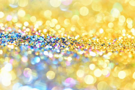 golden glitter texture Colorfull Blurred abstract background for birthday, anniversary, wedding, new year eve or Christmas.の写真素材