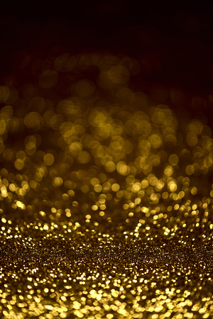 golden glitter texture Colorfull Blurred abstract background for birthday, anniversary, wedding, new year eve or Christmas.の写真素材