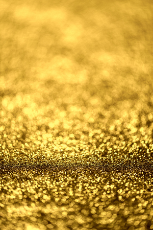golden glitter texture Colorfull Blurred abstract background for birthday, anniversary, wedding, new year eve or Christmas.の写真素材