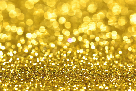 golden glitter texture Colorfull Blurred abstract background for birthday, anniversary, wedding, new year eve or Christmas.の写真素材