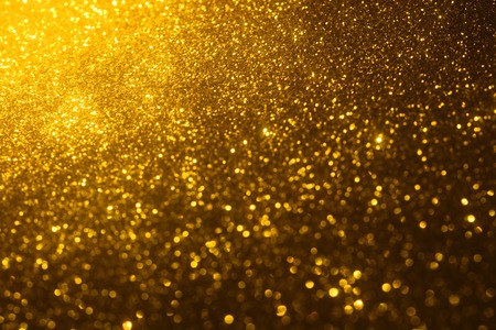 golden glitter texture Colorfull Blurred abstract background for birthday, anniversary, wedding, new year eve or Christmas.の写真素材