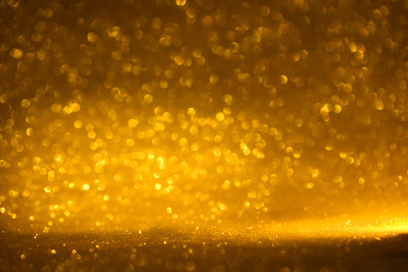 golden glitter texture Colorfull Blurred abstract background for birthday, anniversary, wedding, new year eve or Christmas.の写真素材