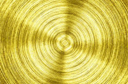 a metal Gold iron with circular texture background.の写真素材