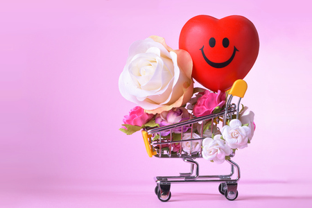 Love and happy Valentines day roses colorful and red heart symbol in shopping cart.の写真素材