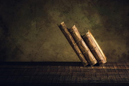 old books vintage on wood floor and paper aged background or texture.の写真素材