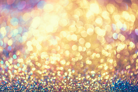 glitter gold bokeh Colorfull Blurred abstract background for birthday, anniversary, wedding, new year eve or Christmas.の写真素材