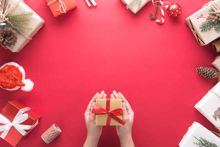 hand holding gift box on occasion of the Merry Christmas and Happy New Year decoration for...