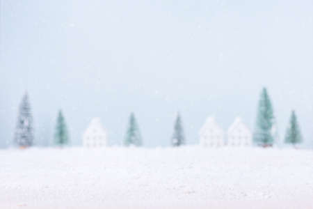 Blurred natural Landscape tree and home of snow background for Merry Christmas and Happy New Year.の写真素材