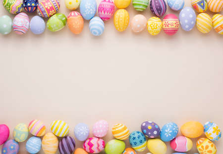 Happy Easter day decoration colorful eggs on paper background with copy space.の写真素材