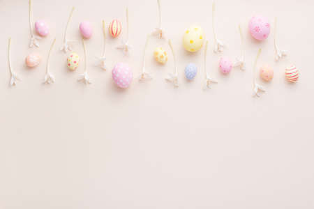 Happy Easter day eggs and flower on paper background with copy space.の写真素材