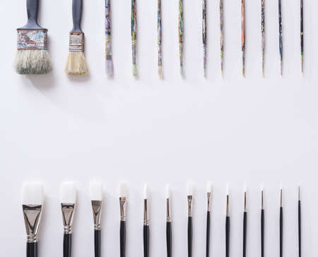 Paint brush on white parchment paper texture background.の写真素材