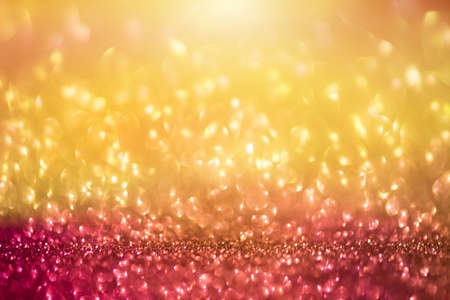 bokeh effect glitter colorful blurred abstract background for birthday, anniversary, wedding, new year eve or Christmas.の写真素材