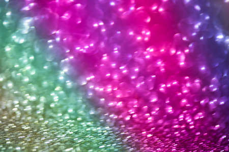 bokeh effect glitter colorful blurred abstract background for birthday, anniversary, wedding, new...