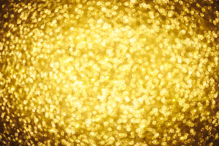 Golden glitter bokeh lighting texture Blurred abstract background for birthday, anniversary,...