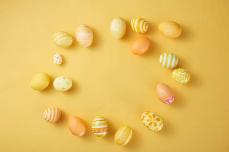 Happy Easter day eggs on paper background with copy space.