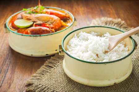 Thai food, River prawn spicy soup or tom yum goong on wooden tableの写真素材